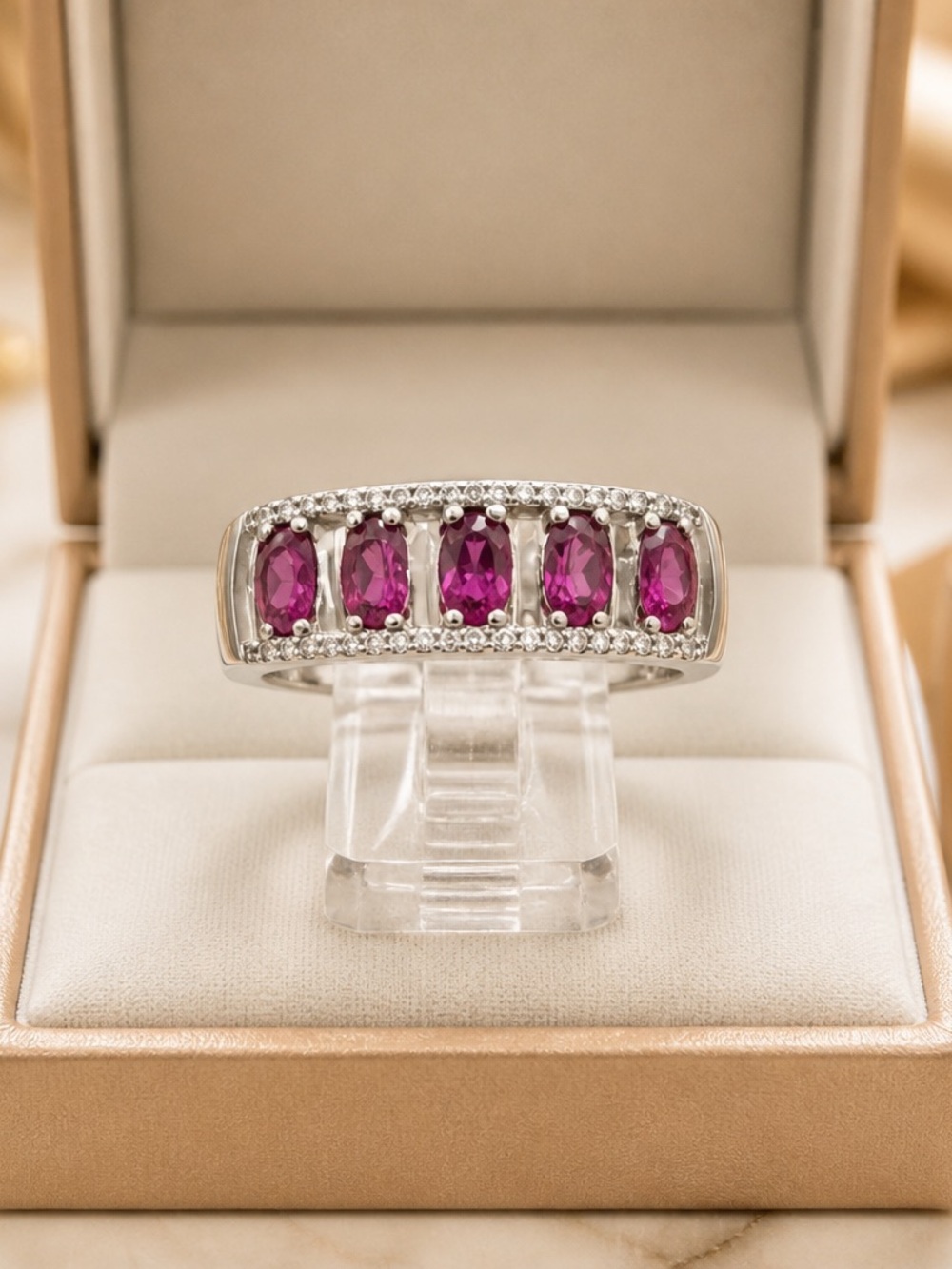Size 8 A Sterling Silver ring with 5 sparkling Suriam Garnets.   
Tested